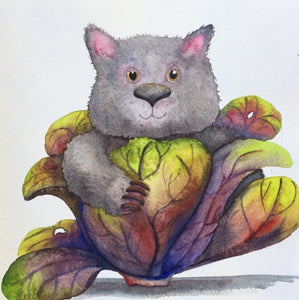 A cute, happy wombat that has made itself comfortable in the centre of a red cabbage.