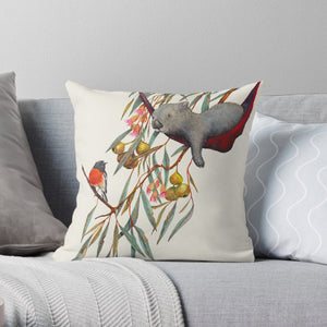 This cushion cover, made in Australia, depicts a wombat relaxing in its wombat having a conversation with a bright scarlet robin. 
